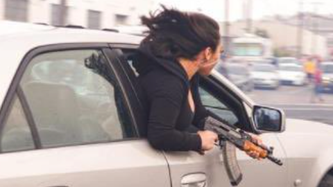 Woman leans out passenger window with AK47 in San Francisco