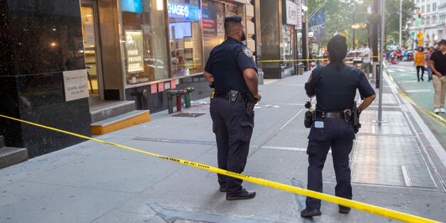 Police at the scene of a hatchet attack.