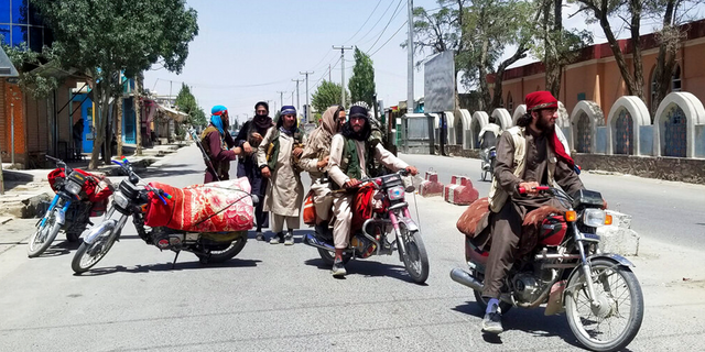 Taliban fighters patrol inside the city of Ghazni, southwest of Kabul, Afghanistan, Thursday, Aug. 12, 2021.