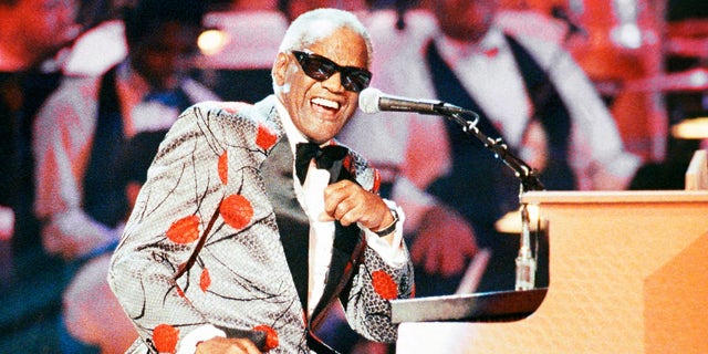 FILE - Ray Charles, performs during the taping of 'Ray Charles: 50 Years in Music, uh-huh,' a benefit musical gala for Starlight/Starbright Foundation in Pasadena, Calif. on Sept. 20, 1991. Charles will be inducted into the Country Music Hall of Fame. (AP Photo/Kevork Djansezian, File)