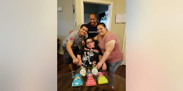 Itza Pantoja, her husband, Adrian, and their son Adrik alongside Dylan.