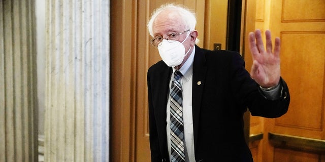 Sen. Bernie Sanders, I-Vt., walks to the Senate floor at the U.S. Capitol in Washington, Aug. 7, 2021. 