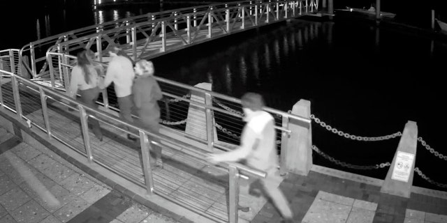 Surveillance video shows Paul Murdaugh (right) and friends walking to his father’s boat in downtown Beaufort shortly before he allegedly crashed into a pylon near Parris Island. The crash killed Mallory Beach and injured several other passengers, including then-girlfriend Morgan Doughty.