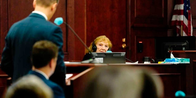 Constance Bennett, the mother of murder victim Bruce Bennett, is questioned by District Attorney John Kellner during Alex Ewing's murder trial. (Philip B. Poston/Sentinel Colorado via AP, Pool)