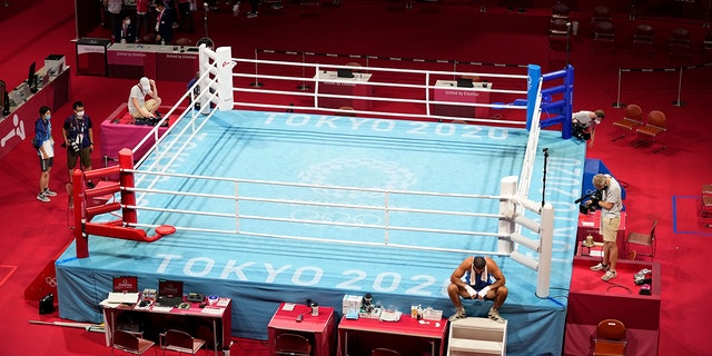 Eliad Mourad, of France refuses to leave the ring after losing a men's super heavyweight over 91-kg boxing match against Britain's Frazer Clarke at the 2020 Summer Olympics, Sunday, Aug. 1, 2021, in Tokyo, Japan. (AP Photo/Frank Franklin II)