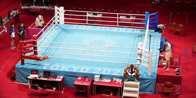Eliad Mourad, of France refuses to leave the ring after losing a men's super heavyweight over 91-kg boxing match against Britain's Frazer Clarke at the 2020 Summer Olympics, Sunday, Aug. 1, 2021, in Tokyo, Japan. (AP Photo/Frank Franklin II)