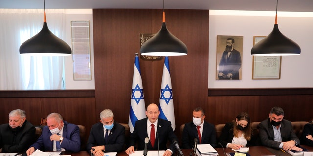 Israeli Prime Minister Naftali Bennett attends a cabinet meeting at his office in Jerusalem, Sunday, Aug. 1, 2021. 