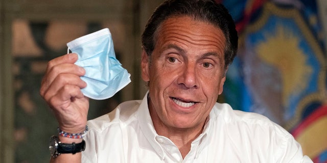New York Gov. Andrew Cuomo discusses the wearing of masks as he speaks at a news conference, in New York, in this May 27, 2021 file photo.