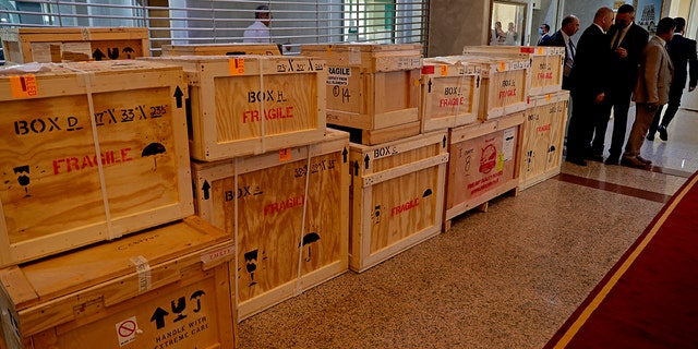 Boxes containing recovered looted artifacts sit temporarily at the foreign ministry before being transferred to the Iraq Museum, in Baghdad, Iraq, Tuesday, Aug. 3, 2021.