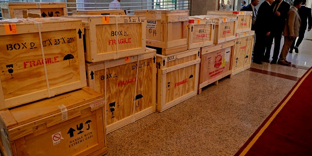Boxes containing recovered looted artifacts sit temporarily at the foreign ministry before being transferred to the Iraq Museum, in Baghdad, Iraq, Tuesday, Aug. 3, 2021.