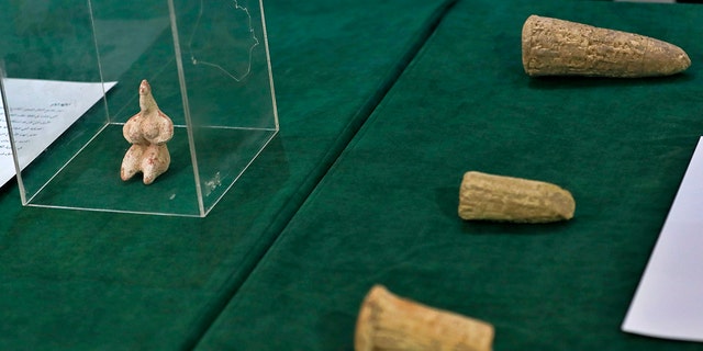 Recently recovered antiquities are displayed at the foreign ministry, in Baghdad, Iraq, Tuesday, Aug. 3, 2021. 