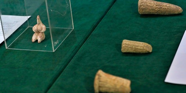 Recently recovered antiquities are displayed at the foreign ministry, in Baghdad, Iraq, Tuesday, Aug. 3, 2021.