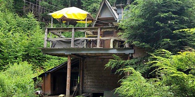 This undated photo provided by Jodie Gedeon shows the shack that David Lidstone, 81, has built and lived in for nearly three decades in the woods of Canterbury, N.H., growing his own food and cutting his firewood. He's now jailed after not complying with a court order to leave, and there's a growing petition to just let "River Dave" live out his days off the grid.