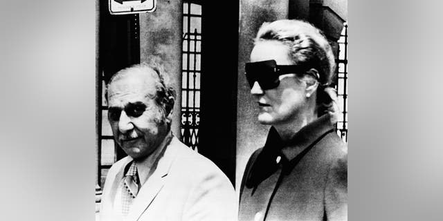 In this June 17, 1971 photo, heiress Doris Duke and her attorney Aram Arabian, leave Superior Court in Providence, R.I.