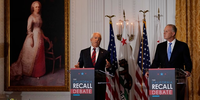 Republican candidate for California Governor John Cox, left, speaks next to fellow candidate Kevin Faulconer during a debate at the Richard Nixon Presidential Library Wednesday, Aug. 4, 2021, in Yorba Linda, Calif. California Gov. Gavin Newsom faces a Sept. 14 recall election that could remove him from office. (AP Photo/Marcio Jose Sanchez)