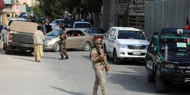 Afghan security personnel arrives at the area where the director of Afghanistan's Government Information Media Center Dawa Khan Menapal was shot dead in Kabul, Afghanistan, Friday, Aug. 6, 2021.