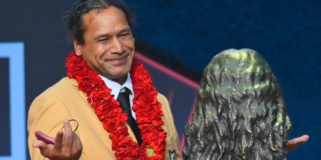 Pro Football Hall of Fame Centennial Class member Troy Polamalu smiles after his bust was unveiled during the Pro Football Hall of Fame induction ceremony on Saturday, August 7, 2021, in Canton, Ohio.  (Associated press)