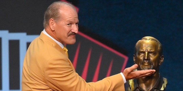 Bill Cowher, a member of the Pro Football Hall of Fame Centennial Class, smiles after unveiling a bust of himself during the Pro Football Hall of Fame induction ceremony on Saturday, August 7, 2021, in Canton, Ohio .  (Associated press)