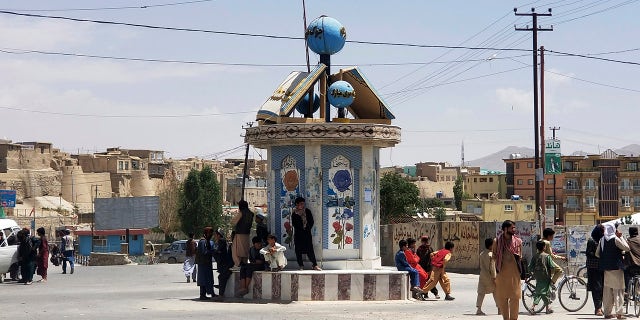 A Taliban flag flies at a square in the city of Ghazni, Afghanistan, after fighting between Taliban and Afghan security forces Thursday, Aug. 12, 2021. The Taliban captured the provincial capital near Kabul on Thursday, the 10th the insurgents have taken over a weeklong blitz across Afghanistan as the U.S. and NATO prepare to withdraw entirely from the country after decades of war. (AP Photo/Gulabuddin Amiri)