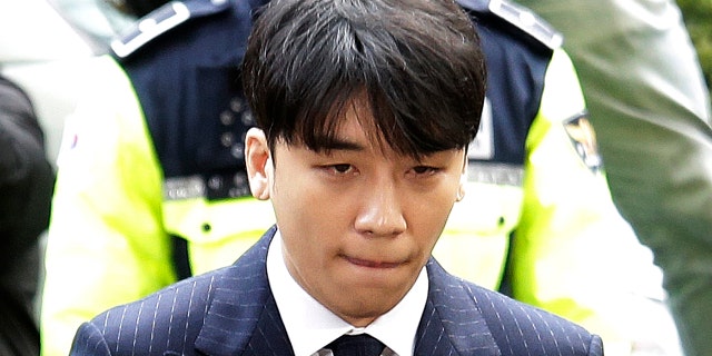 Seungri, a former member of a popular K-pop boy band Big Bang, arrives at the Seoul Metropolitan Police Agency in Seoul, South Korea, in March 2019.