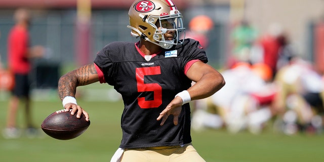San Francisco 49ers quarterback Trey Lance throws a pass at NFL football training camp in Santa Clara, Calif., Tuesday, Aug. 10, 2021. The 49ers are read to show off their shiny new quarterback to the public when rookie Trey Lance gets ready to play in his first exhibition game this weekend. (AP Photo/Jeff Chiu)