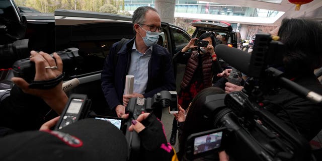 FILE - In this file photo dated Wednesday, Feb. 10, 2021, Peter Ben Embarek of a World Health Organization team speaks to journalists as he arrives at the airport to leave, at the end of their WHO mission to investigate the origins of the coronavirus pandemic in Wuhan in central China's Hubei province. When WHO traveled to China earlier this year to investigate the origins of the COVID-19 pandemic, Peter Ben Embarek said he was worried about biosafety standards at a laboratory close to the market where the first human cases were detected, according to a documentary released Thursday Aug. 12, 2021, by TV2, a Danish television channel. (AP Photo/Ng Han Guan, FILE)