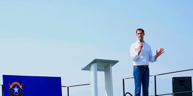 U.S. Sen. Tom Cotton speaks to the crowd, Saturday, Aug. 14, 2021, at Morning in Nevada PAC's Basque Fry at Corley Ranch in Gardnerville, Nev. Cotton told a crowd of about 4,000 Nevada Republicans that Adam Laxalt planned to run for the U.S. Senate against Democrat Catherine Cortez Masto. (AP Photo/Sam Metz)