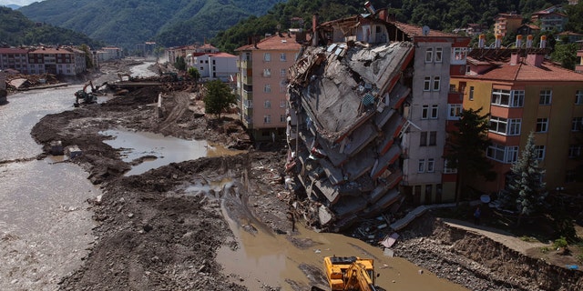 An aerial view of the city center in Bozkurt town of Kastamonu province, Turkey, Sunday, Aug. 15, 2021, damaged after flooding. Turkey sent ships to help evacuate people and vehicles from a northern town on the Black Sea that was hard hit by flooding, as the death toll in the disaster rose Sunday to at least 62 and more people than that remained missing. (AP Photo)