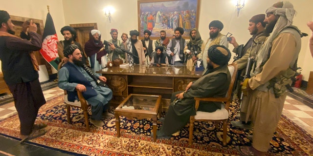 Taliban fighters take control of the Afghan presidential palace after Afghan President Ashraf Ghani fled to Kabul, Afghanistan on Sunday, August 15, 2021.