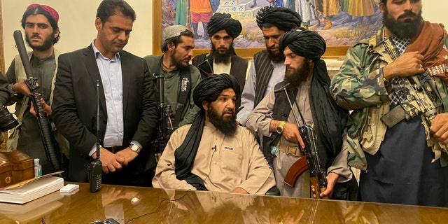 Taliban fighters take control of the Afghan presidential palace after President Ashraf Ghani fled the country on Sunday, August 15, 2021 in Kabul, Afghanistan.