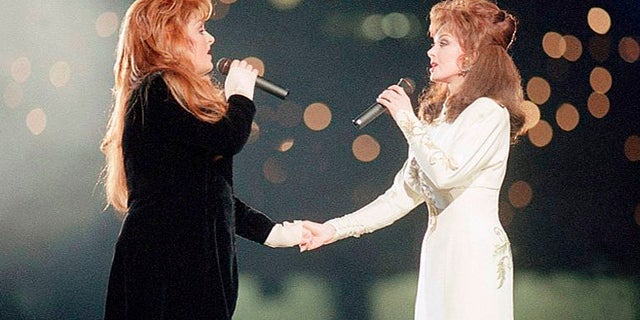 Wynonna Judd and her mother Naomi perform during the halftime show at Super Bowl XXVIII in Atlanta on Jan. 30, 1994.