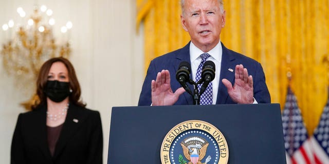 President Joe Biden speaks about the evacuation of American citizens, their families, SIV applicants and vulnerable Afghans in the East Room of the White House, Friday, Aug. 20, 2021, in Washington. Vice President Kamala Harris listens at left. (AP Photo/Manuel Balce Ceneta)