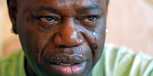 Aaron Larry Bowman cries during an interview at his attorney's office in Monroe, La., Thursday, Aug. 5, 2021, as he discusses his injuries resulting from a Louisiana State trooper pummeling him with a flashlight during a traffic stop in 2019.