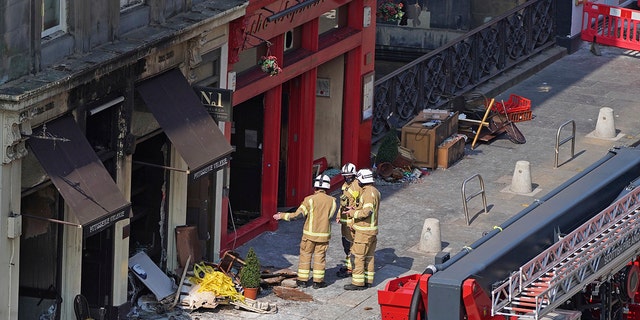 Firefighters at the scene after a fire at the Elephant House Cafe in Edinburgh, Wednesday, Aug. 25, 2021. An Edinburgh cafe where author J.K. Rowling wrote some of the Harry Potter books has been damaged in a fire. The Elephant House in the Scottish capital was blackened by a blaze which broke out at the patisserie next door on Tuesday.