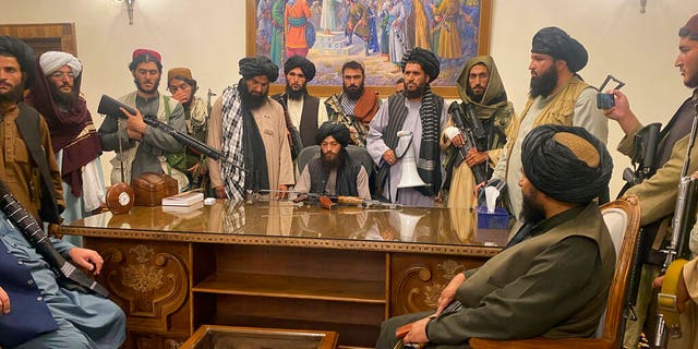 FILE - In this Aug. 15, 2021 file photo, Taliban fighters take control of Afghan presidential palace in Kabul, Afghanistan, after President Ashraf Ghani fled the country. (AP Photo/Zabi Karimi, File)