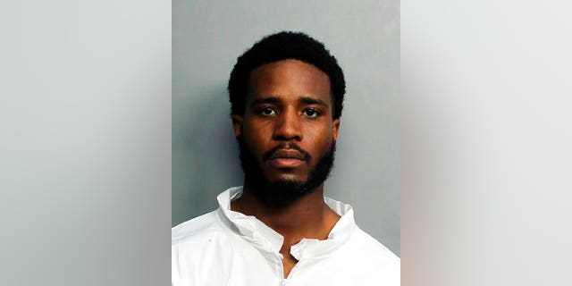 This image provided by the Miami-Dade Police Department shows Tamarius Blair Davis Jr., who shot and killed a tourist having dinner with his family at a Miami Beach restaurant, police and a family member said. . 