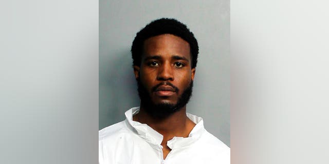 Tamarius Blair Davis Jr., who fatally shot a tourist eating dinner with his family at a Miami Beach restaurant, police and a family member said. Davis Jr., 22, of Norcross, Georgia, told investigators he shot Dustin Wakefield, 21, on Tuesday night because he "was high on mushrooms, which made him feel empowered," according to his arrest report. (Miami-Dade Police Department via AP)