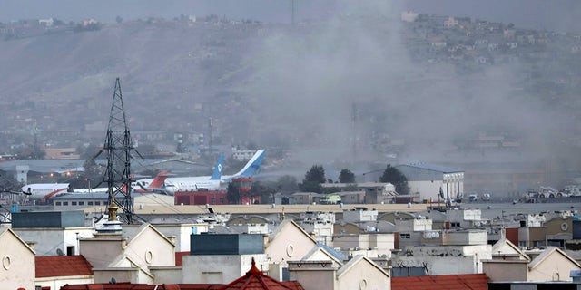 Smoke rises from a deadly explosion outside the airport in Kabul, Afghanistan, Thursday, Aug. 26, 2021. (Associated Press)