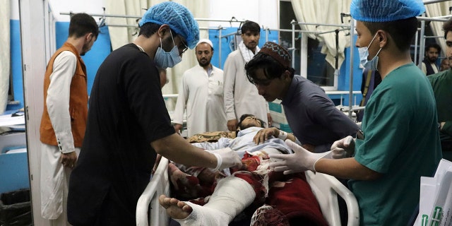 A victim receives medical assistance in a hospital after he was wounded in the deadly attacks outside the airport in Kabul, Afghanistan, Thursday, Aug. 26, 2021. (Associated Press)