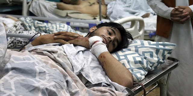 Afghans lie on beds at a hospital after they were wounded in the deadly attacks outside the airport in Kabul, Afghanistan, Thursday, Aug. 26, 2021. (Associated Press)