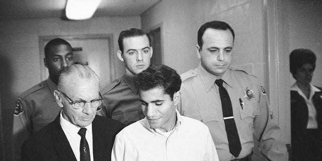 In this June 28, 1968, file photo, Sirhan Bishara Sirhan is escorted by his attorney, Russell E. Parsons from Los Angeles County jail chapel to enter plea to charge of murder in Los Angeles. 