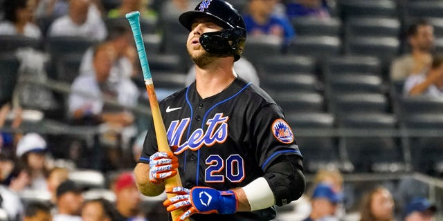 The New York Mets' Pete Alonso reacts after striking out during the first inning of a baseball game against the Washington Nationals, Friday, Aug. 27, 2021, in New York.
