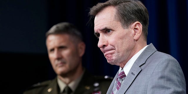 Pentagon spokesman John Kirby, right, and Army Maj. Gen. William "Hank" Taylor, left, listen to questions during a briefing at the Pentagon in Washington, Saturday, Aug. 28, 2021.