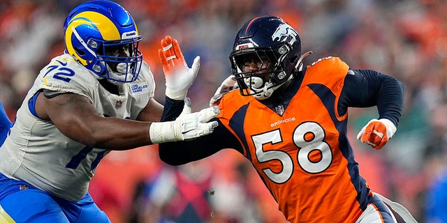 Denver Broncos outside linebacker Von Miller (58) battles Los Angeles Rams offensive guard Tremayne Anchrum (72) during the first half of an NFL preseason football game, Saturday, Aug. 28, 2021, in Denver.