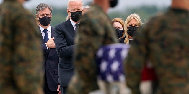 President Joe Biden, First Lady Jill Biden, and Secretary of State Antony Blinken watch as a transport crew moves a transfer case with the rest of Marine Corps Cpl.  Humberto A. Sanchez, 22, of Logansport, Ind., During a return to Dover Air Force Base, Del., Sunday, August 29, 2021, for the 13 service members killed in the suicide bombing in Kabul, Afghanistan, August 26 .  (AP Photo / Carolyn Kaster)