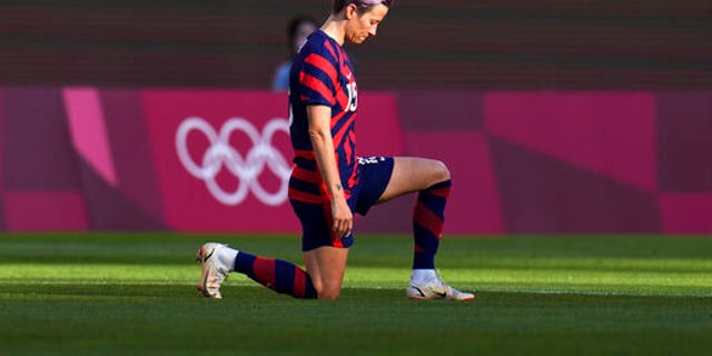 United States' Megan Rapinoe kneels prior to the women's bronze medal soccer match against Australia at the 2020 Summer Olympics, Thursday, Aug. 5, 2021, in Kashima, Japan. (AP Photo/Fernando Vergara)