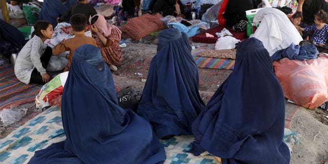 Internally displaced Afghans from northern provinces, who fled their home due to fighting between the Taliban and Afghan security personnel, take refuge in a public park Kabul, Afghanistan, Friday, Aug. 13, 2021. (AP Photo/Rahmat Gul)
