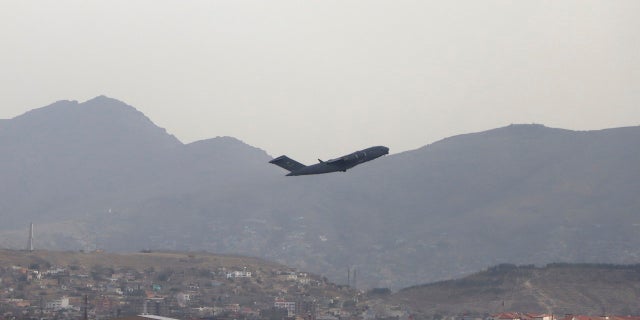 A US military plane takes off from Hamid Karzai International Airport in Kabul, Afghanistan.