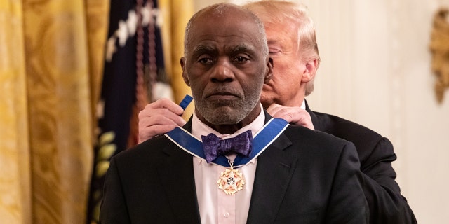 U.S. President Donald Trump presents Alan Page, former Minnesota Supreme Court Justice, and professional football player, with the Presidential Medal of Freedom, in the East Room of the White House in Washington, D.C., on Friday, Nov. 16, 2018. (Cheriss May/NurPhoto via Getty Images)
