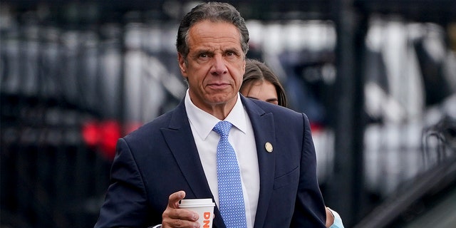 New York Gov. Andrew Cuomo prepares to board a helicopter after announcing his resignation, Tuesday, Aug. 10, 2021, in New York. Cuomo says he will resign over a barrage of sexual harassment allegations. The three-term Democratic governor's decision, which will take effect in two weeks, was announced Tuesday as momentum built in the Legislature to remove him by impeachment. (AP Photo/Seth Wenig)